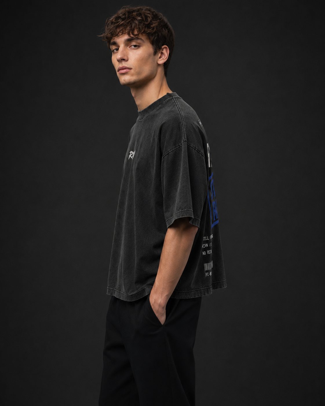 First Cut boxy oversized tee, washed matte black, studio view — RIVN FC-001